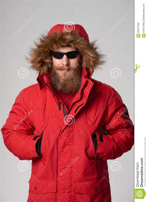 Man Wearing Red Winter Alaska Jacket With Fur Hood On Stock Photo