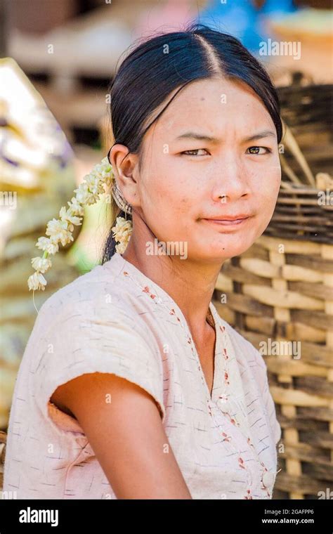 Pretty Young Burmese With Hair Garland And Traditional Blouse Sits