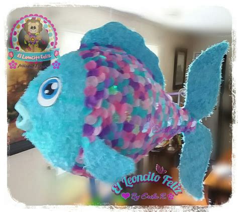 A Blue Stuffed Fish With Multicolored Bubbles On Its Head And Eyes