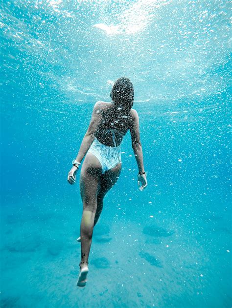 Woman Swimming Underwater Photo By Jeremy Bishop Tentides On Unsplash