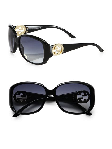 gucci crystal gg accented plastic oval sunglasses in black lyst