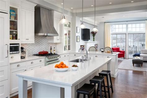 The rustic kitchen island look also adds some warmth to the space. Traditional White Kitchen With Marble Topped Work Island ...