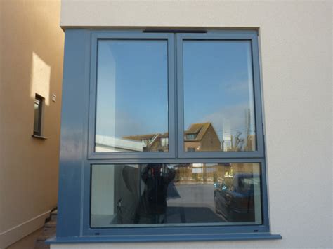 I am not sure about the type of anodize process, we just ask for black. Anodised Aluminium Windows