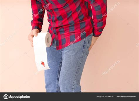Young Man Holding Toilet Paper Blood Spot Color Background Hemorrhoids