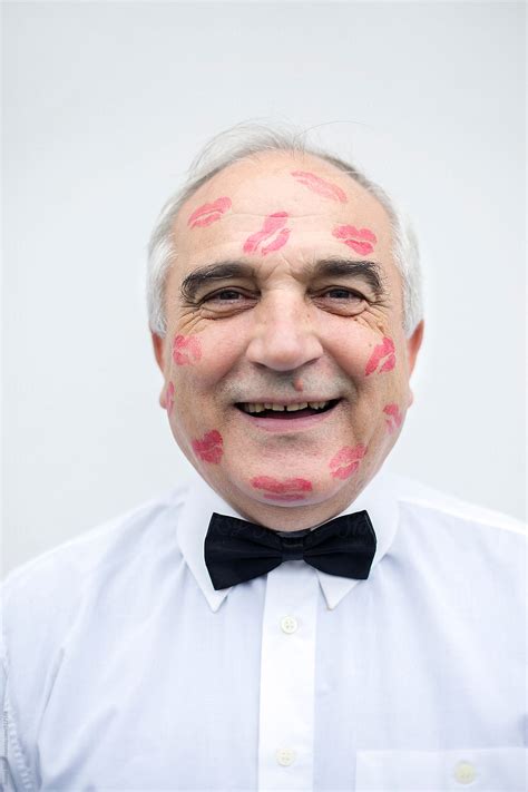 Portrait Of An Old Man With Red Lip Print On His Face By Stocksy Contributor Jovana Rikalo