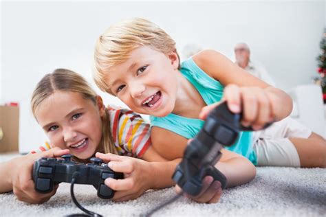 Siblings Having Fun Playing Video Games On The Floor Stem Minds