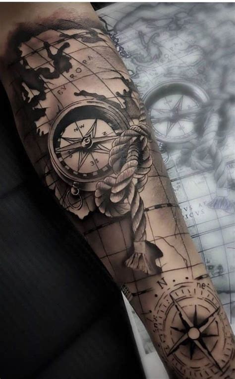 A Man S Arm With A Compass And Rose Tattoo Design On The Left Forearm