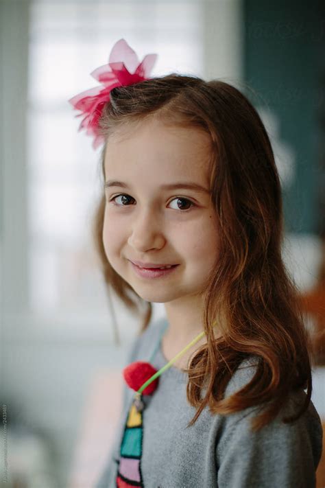 Portrait Of An Adorable Girl Wearing A Bow By Jakob Lagerstedt