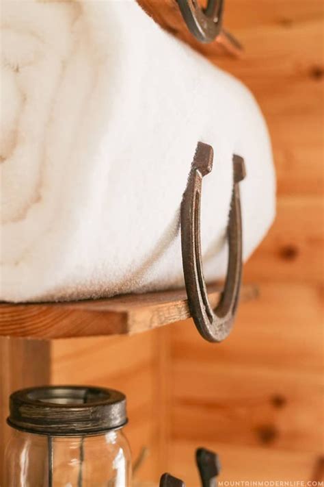 How To Make A Rustic Bathroom Shelf Using Horseshoes Rustic Bathroom