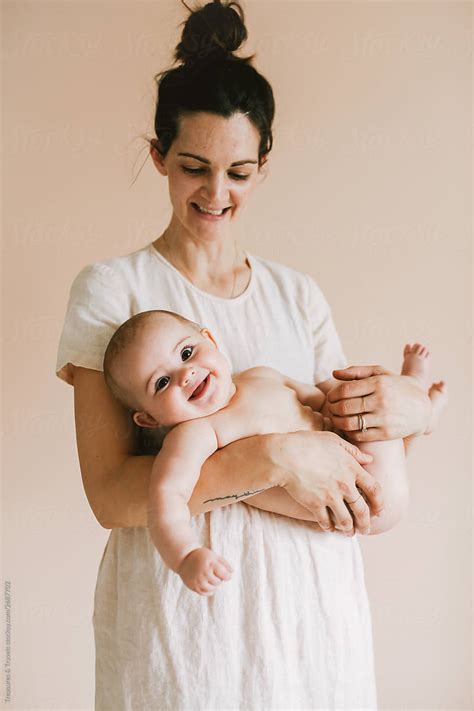 Mom Holding Naked Baby By Stocksy Contributor Pink House Organics