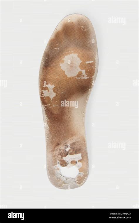 Old And Shabby Orthopedic Insoles Isolated On White Background Dirty