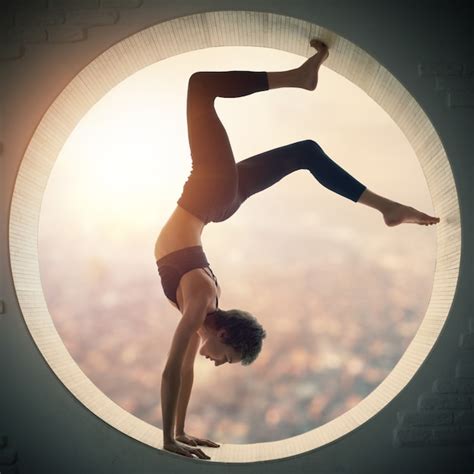 Premium Photo Beautiful Sporty Fit Yogi Woman Practices Yoga Handstand Asana Bhuja