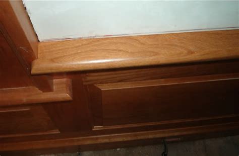 Always start by cutting the return 'cap'—that's the little piece that caps the end of the molding. Pictures Installing Crown Molding
