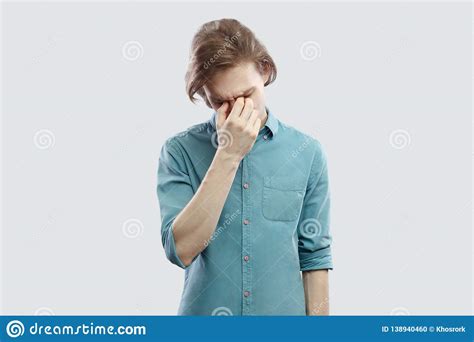 Portrait Of Sad Alone Handsome Long Haired Blonde Young Man In Blue