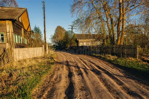 Country Dirt Road With Deep Gauge On The Spring Sunset Russian Village