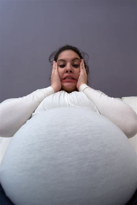 Extreme Angle View Of Pregnant Momâ€ S Giant Baby Bump Stock Image