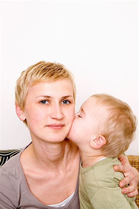 Boy Kissing Mothers Cheek D Sseldorf License Image Lookphotos