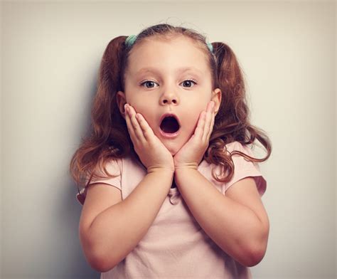 Fun Surprising Kid Girl With Opened Mouth Looking Toned Portrai The