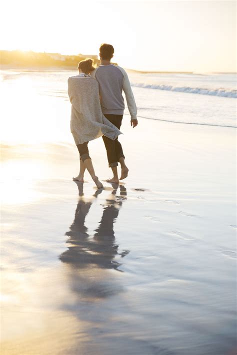 loving couple walking on the beach at sunset my love and i have done this many times and many