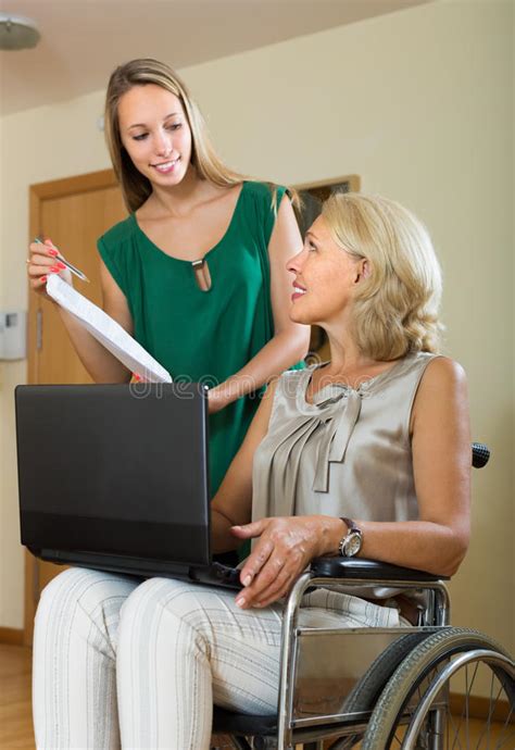 social worker and handicapped woman with laptop stock image image of invalid incapacitated