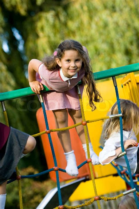 A Smiling Schoolgirl In A Playground Stock Image Colourbox