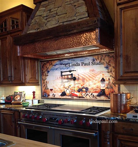 Beautiful italian tile backsplash mural of a kitchen window featuring a still life of olive tiles, grapes, bread, cheese, garlic, olive oil, olives, rosemary, lemons and a hummingbird by american artist linda paul. Italian tile murals - Tuscan Backsplash tiles