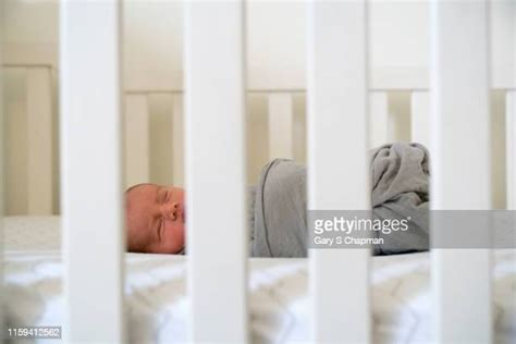 Hispanic Baby Sleeping In Crib Photos And Premium High Res Pictures