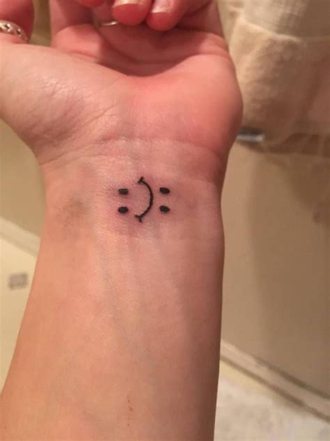 Smiling clown face tattoo on arm. Related image | Bipolar tattoo, Autism tattoos, Tattoos