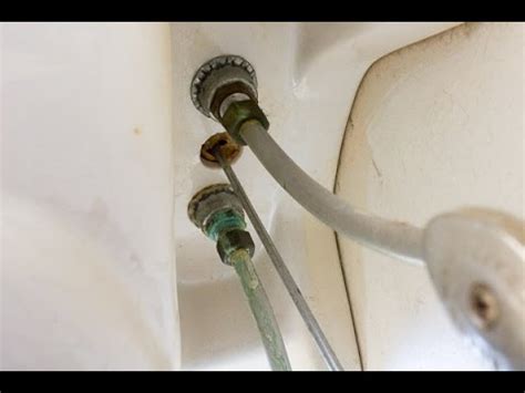 To begin repairing the leaking tap, first, undo the screws on the faucet's handles. How to fix pipework to a tap (faucet) leaking under the ...