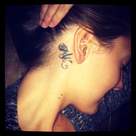 Awesome geometric ear tattoos for guys with spiral design. Best friend initials. Morgan and Katy. Best friends forever