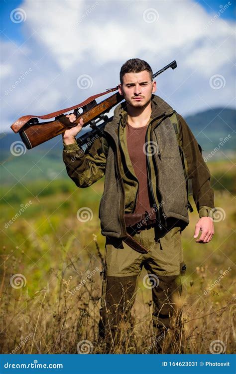 Hunting Season Hunting Weapon Gun Or Rifle Man Hunter Carry Rifle