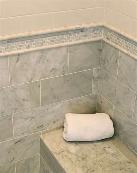 Bathroom with white subway tile herringbone walls and carrara marble mosaic tile floor. Beach House - Home Bunch - An Interior Design & Luxury ...