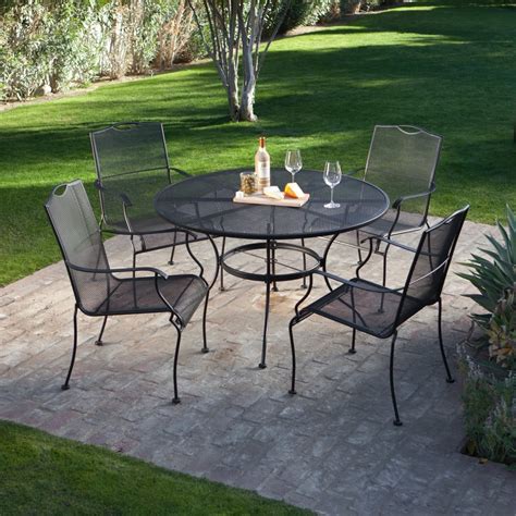 I searched for reasonably priced outdoor metal chairs and came across these. 5-Piece Wrought Iron Patio Furniture Dining Set - Seats 4 ...