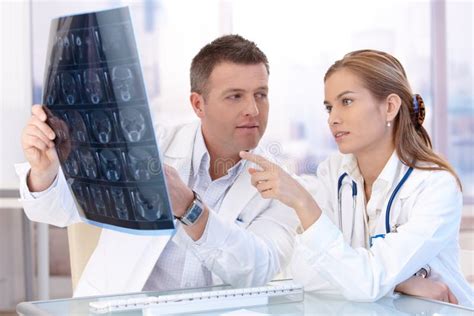 Male And Female Doctors Consulting In Office Stock Photo Image Of
