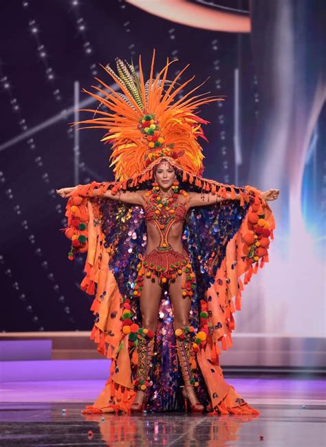 a woman in a colorful costume on stage