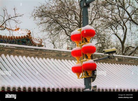 Explore the allure of traditional lanterns in a sunlit Chinese street