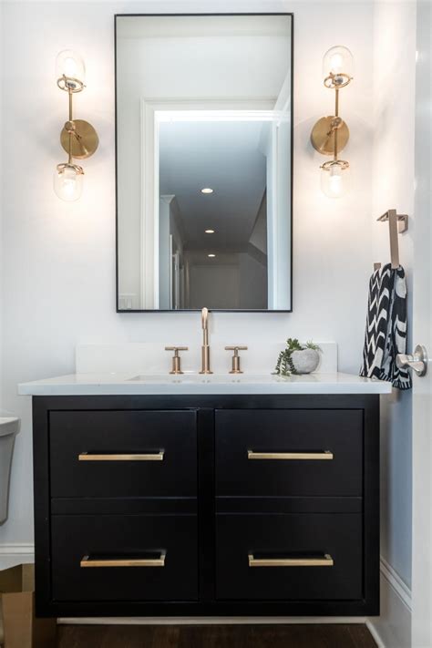 Find the best bathroom vanity cabinets with mirrors at sears. Powder Room Has Black Vanity With Gold-Toned Faucet and ...