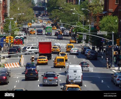 Traffic Heading Down A Busy New York City Street United States Stock