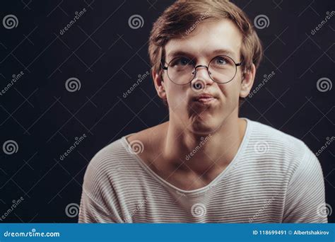 Close Up Portrait Of Thoughtful Frowning Student In Glasses Stock Image