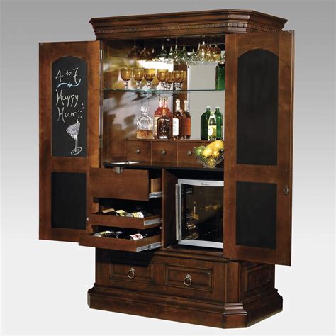 An Old Fashioned Bar Cabinet With Wine Glasses And Liquor Bottles On