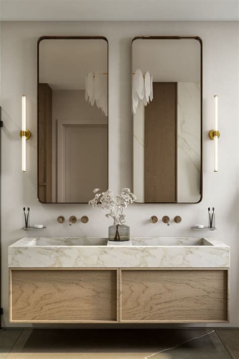 A Bathroom With Two Sinks And Mirrors On The Wall