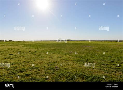Large Open Green Grass Field Wide And Infinite View Stock Photo Alamy