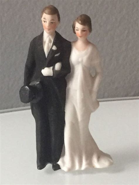 antique porcelain wedding cake topper bride and groom top hat and tails wedding gown and gloves