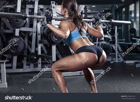 Beautiful Sporty Sexy Woman Doing Squat Workout In Gym Stock Photo Shutterstock