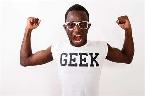 Studio Shot Of Young Black African Nerd Man Wearing Geek Shirt While