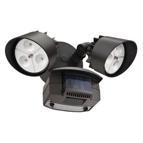 Outdoor motion sensor lights can be placed anywhere on your property. Lithonia Lighting Twin Head Bronze Motion-Sensing Outdoor ...