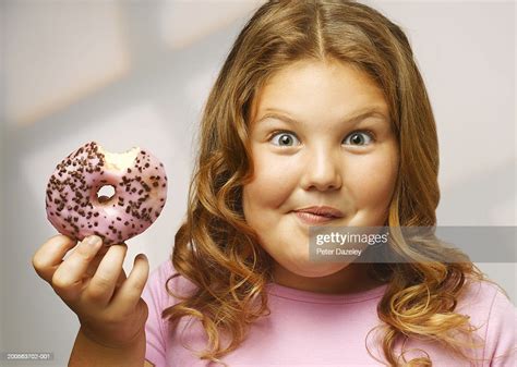 Overweight Girl Eating Doughnut Smiling Portrait Closeup Photo Getty