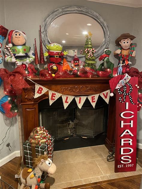 a fireplace decorated for christmas with ornaments and decorations