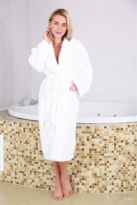 likka blonde model likka removes a white bathrobe before touching her naked body r18hub