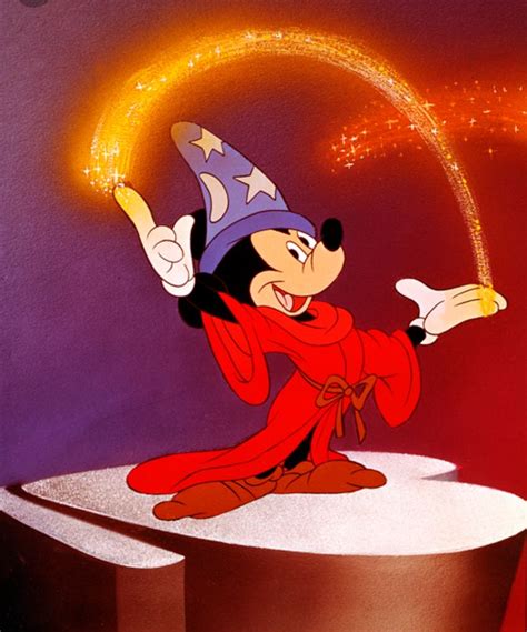 The Cartoon Mickey Mouse Is Wearing A Wizard Hat And Holding A Wand In His Hand